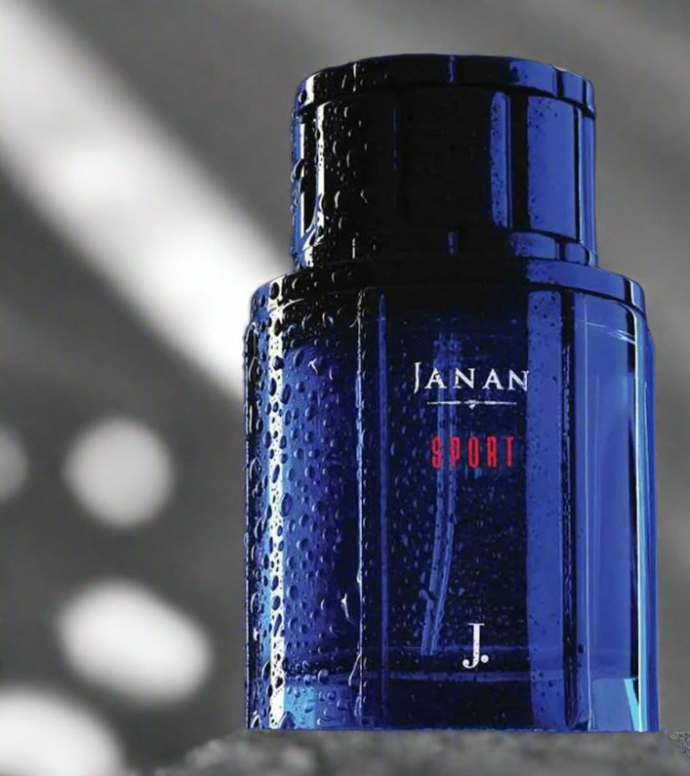 perfume bottle on textured asphalt ground with white sports line marking,urban athletic feel.