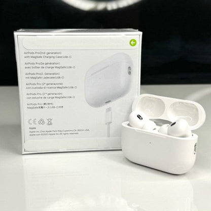 White wireless earbuds in a charging case with packaging on a white background